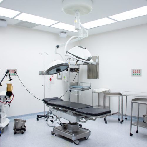 empty-operating-room-with-wheeled-tables-one-stretcher
