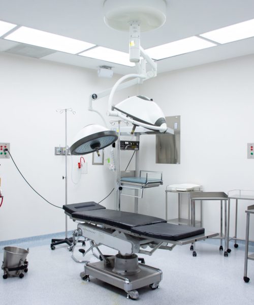 empty-operating-room-with-wheeled-tables-one-stretcher